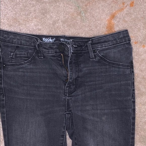A pair of grey jean that have knees holes - Picture 2 of 3
